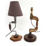 An unusual table lamp constructed from an early brace drill and another of similar form. The tallest