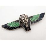 Egyptian Revival : A white metal brooch formed as a Pharaoh and wings with enamel decoration 3" wide