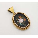 Grand Tour Jewellery : A gilt metal locket of oval form set with oval pietra dura panel depicting