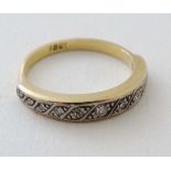 An 18ct gold ring set with 11 graduated diamonds  CONDITION: Please Note -  we do not make reference