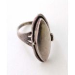 A silver ring with hinged section to centre  CONDITION: Please Note -  we do not make reference to