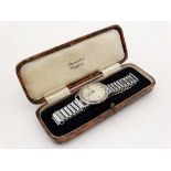 A Gentleman's Helios wristwatch , a chrome plated strap and cased watch with silvered convex dial,