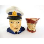 A Royal Doulton '' Cardinal '' D6033. Marked to base. 3 1/2'' high. Together with a Burleigh ware