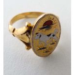 A yellow metal signet ring with dog and sunrise enamel detail. Marked verso with Oriental