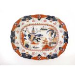 A large mid Victorian ironstone platter . In an Imari style pattern with a transfer printed design