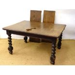 A c.1900 oak wind out extending dining table ( with 2 leaves ) on four barley twist legs with