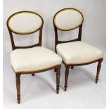 A pair of 19thC Continental mahogany single chairs with overstuffed seats and upholstered back