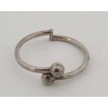 A Mexican silver bracelet of bangle form  CONDITION: Please Note -  we do not make reference to