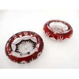 Flash cut Glass : two Bohemian flash cut ruby and clear glass ashtrays , each 6 3/5" diameter