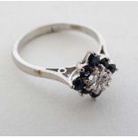 An 18ct white gold ring set with diamonds and sapphires  CONDITION: Please Note -  we do not make