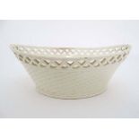 A boat shaped pierced creamware basket having double row of pierced detail to rim and basket