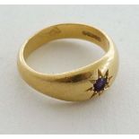 A 18ct gold ring set with central amethyst ( total weight 10g) 
 CONDITION: Please Note -  we do not