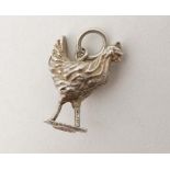 A silver pendant charm formed as a chicken . Marked silver under. Approx 1" high  CONDITION: