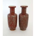 A pair of Chinese vases. With red and green glaze in a Sang du Boeuf and Celadon style. 10 1/4''