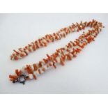 A vintage early - mid 20thC necklace of coral and hardstone beads with silver clasp. approx 32" long