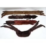 4 vintage fur stoles: mid brown long mink? stole with tail trim and black velvet lining. Silver