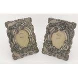 A pair of C.1900 Japanese metallic easel frames depicting two 3-toed dragons around a horseshoe.
