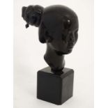 A 1930's Chinese signed bronze bust of a female figure on a squared ebonised socle . Signed verso 13