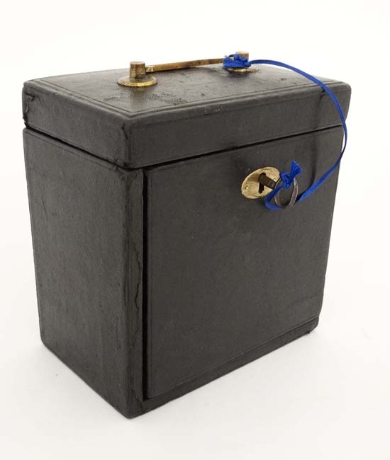 A 19thC leather covered jewellery casket with hinged top and front. 6 1/4" high x 5 7/8" wide x 3