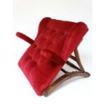 A Victorian mahogany and oak button back red velvet upholstered adjustable bed rest with short