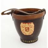 A mid - late 20thC small leather fire bucket with brass studs etc 6 1/2" diameter  CONDITION: Please