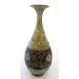 A Royal Doulton Art Nouveau stoneware vase of inverted baluster shape with flared rim decorated with