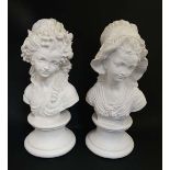 A pair of plaster busts of late 18thC figures on a turned socle base. Approx 11 3/4" high