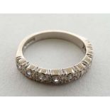 An 18ct white gold half eternity ring set with 9 diamonds  CONDITION: Please Note -  we do not