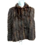 A Ladies short vintage dark brown mink style fur cape, with dark brown fur lining, 3 hooks to