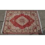 Rug carpet : A machine-made rug in the style of a Persian rug. 75 x 55”. CONDITION: Please Note -