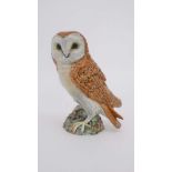 A Beswick figure of an owl. Number 1046. With impressed and stamped Beswick mark to base. 7 1/2''