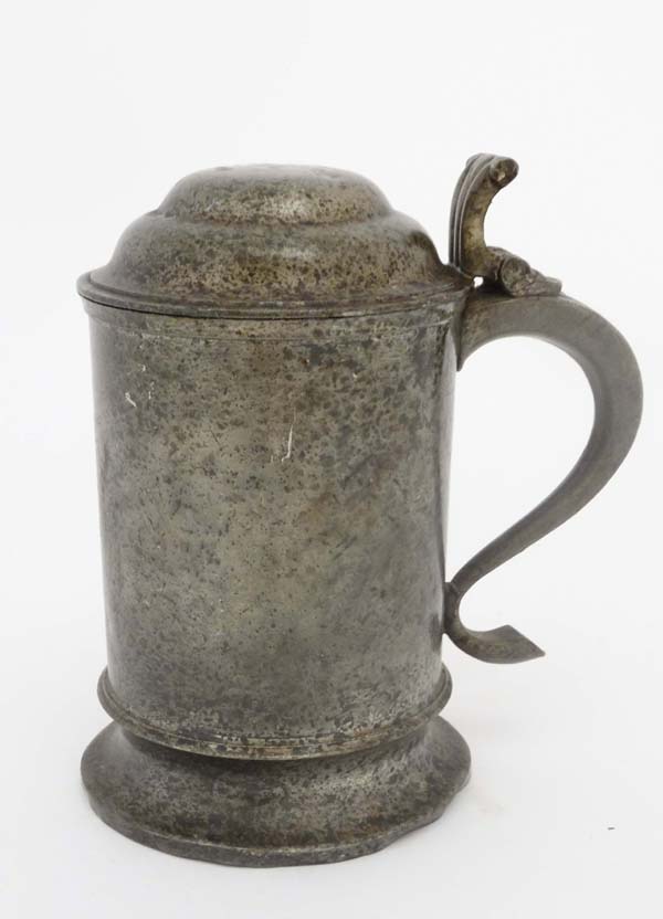 A c.1900 hinged lidded pewter tankard, indistinctly marked under 6 1/2" high  CONDITION: Please Note