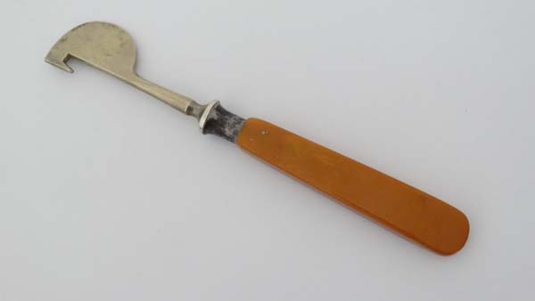 A nickel orange peeler with celluloid handle. Approx 5 1/3" long  CONDITION: Please Note -  we do - Image 3 of 3