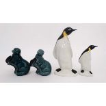Two graduated Poole penguins. Stamped factory mark to base. The taller 8 1/4'' high. The smaller 5