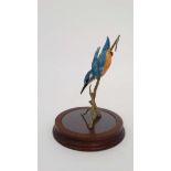 A Border Fine Arts study of a diving kingfisher on a wooden stand. Makers sticker to base. 7 1/2''