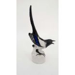 A Lomonsov USSR 1960's figure of a magpie . Stamped factory mark to base. 10'' high.
 CONDITION: