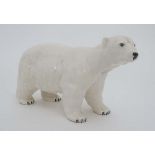 A Beswick polar bear. Factory stamp to base. 4 1/2'' high. 
 CONDITION: Please Note -  we do not