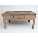 A Victorian pine farmhouse kitchen table with single drawer to long side and staning on four squared