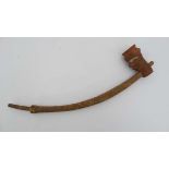 Native Tribal : an African smoking pipe carved with the head of an European head as decoration
