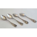 A set of 4 white metal teaspoons with engine turned engraved decoration to handles 4 1/2" high