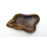 A Chinese dark russet jade? ink dish with carved decoration approx 4 1/4" long  CONDITION: Please