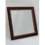 A Contemporary mahogany veneerer wall mirror with gilt slip . the whole 30 3/4" sq.  CONDITION: