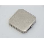 A silver plate powder compact with mother of pearl and shamrock decoration 1 3/4" wide  CONDITION: