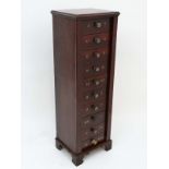 A 19thC mahogany collectors/ filing cabinet of Wellington form having 10 drawers with divisions