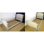 A pair of painted single Louis XV style beds with padded head and footboards each 42" wide