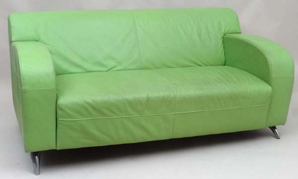 Vintage Retro : a contemporary lime green leather 2 seat sofa with cast aluminium feet, stitched