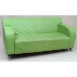 Vintage Retro : a contemporary lime green leather 2 seat sofa with cast aluminium feet, stitched