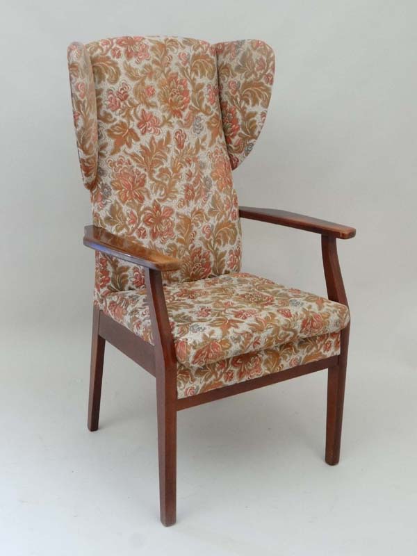 Vintage Retro : a Parker Knoll wing back open armchair, with stained beech arms and legs. 46 1/2"