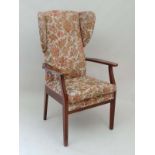 Vintage Retro : a Parker Knoll wing back open armchair, with stained beech arms and legs. 46 1/2"