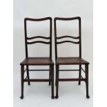 Art Deco : A pair of designer caned seated oak chairs with turned tapering front legs terminating in